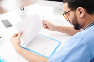 Doctor checking documents